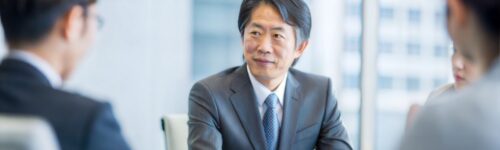 Management team working on a buyout transaction with advisers – Moore Australia