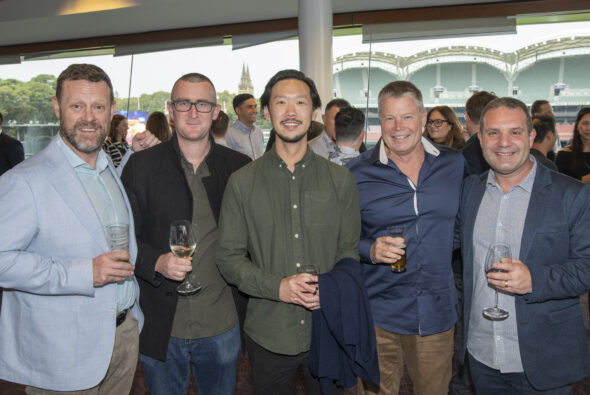 Team of Moore Advisors at dinner party