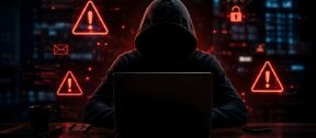 Australian business owner reviewing a suspicious payment request linked to AI-enabled fraud and cybercrime risks.